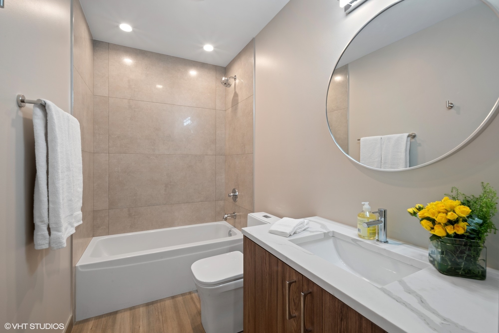 4448 South Drexel Boulevard, Unit A Chicago, IL 60653 - Photo 12 of 16 a bathroom with a granite countertop sink a toilet and shower