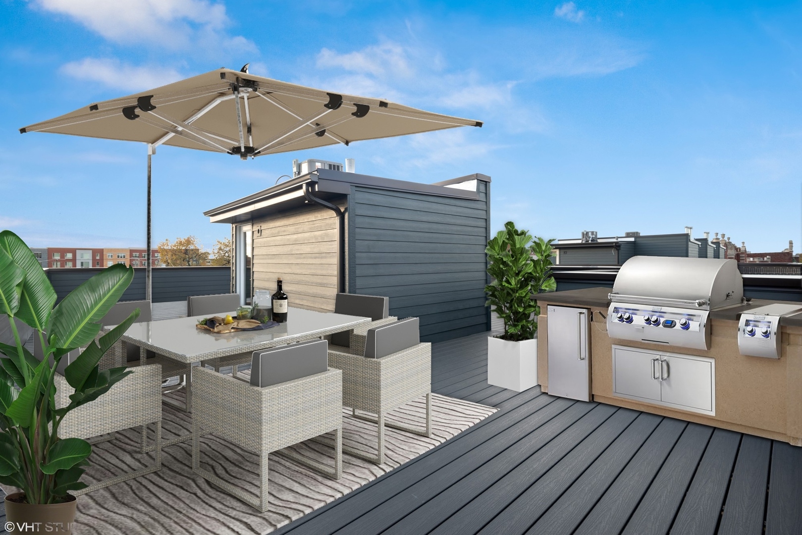 4448 South Drexel Boulevard, Unit A Chicago, IL 60653 - Photo 14 of 16 a view of a roof deck with table and chairs barbeque oven with wooden floor
