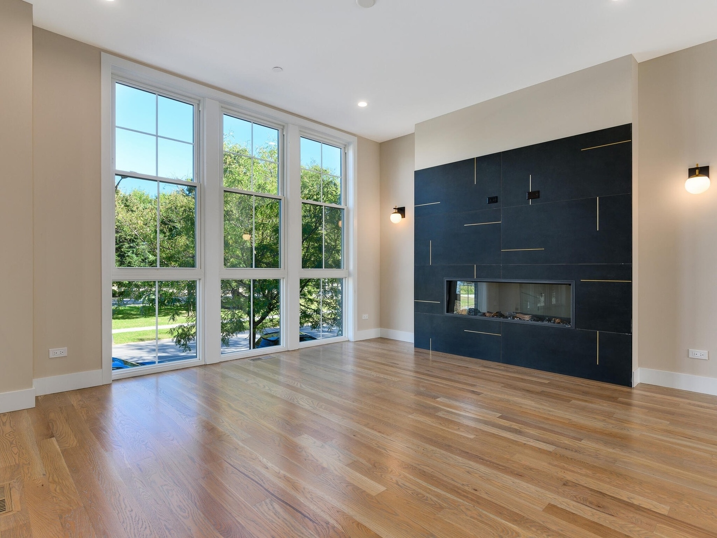 4448 South Drexel Boulevard, Unit A Chicago, IL 60653 - Photo 2 of 16 a view of an empty room with wooden floor and a window