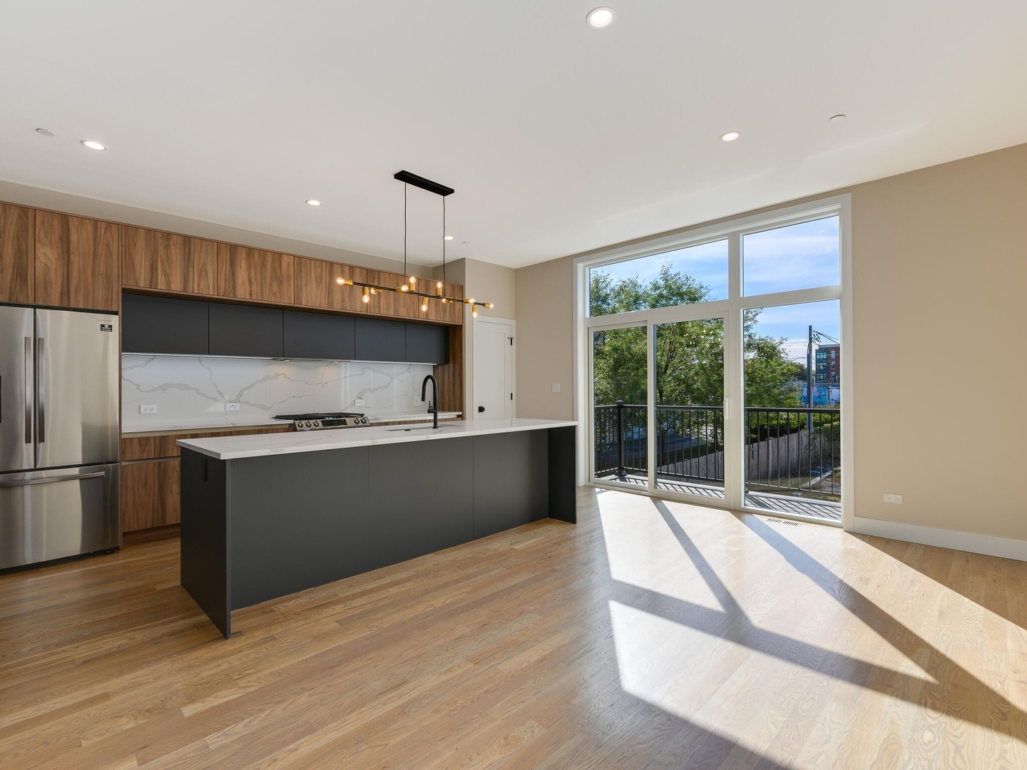 4448 South Drexel Boulevard, Unit A Chicago, IL 60653 - Photo 7 of 16 a kitchen with granite countertop a refrigerator and a sink