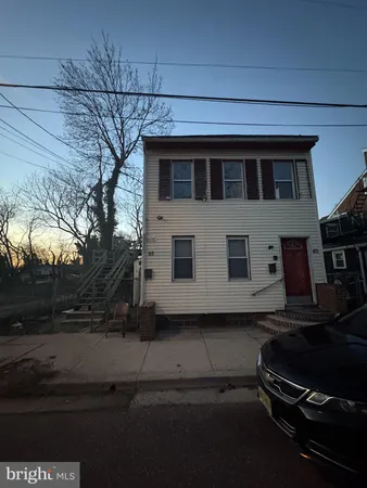 a house with trees in the background