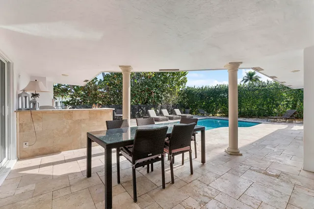 a bathroom with a granite countertop sink a mirror and a