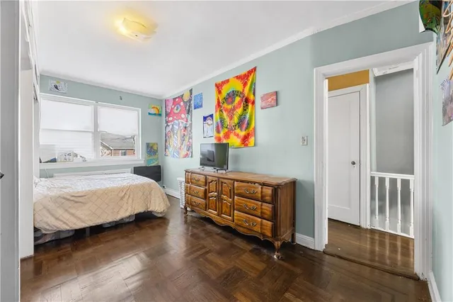 a bedroom with furniture and window
