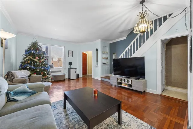 a living room with furniture and a flat screen tv