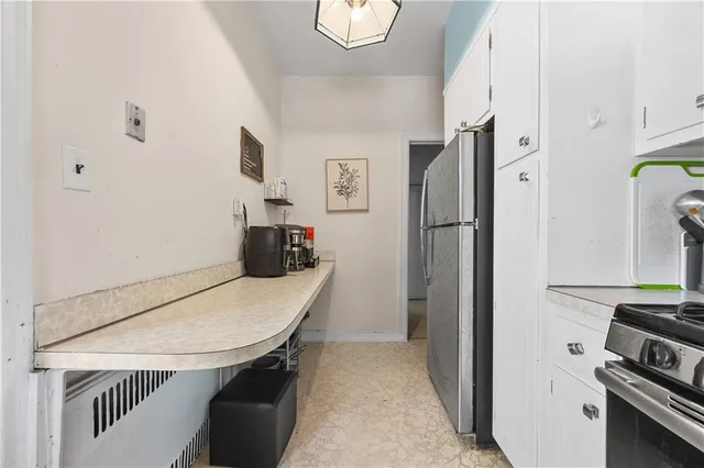 a kitchen with stainless steel appliances a refrigerator and a stove