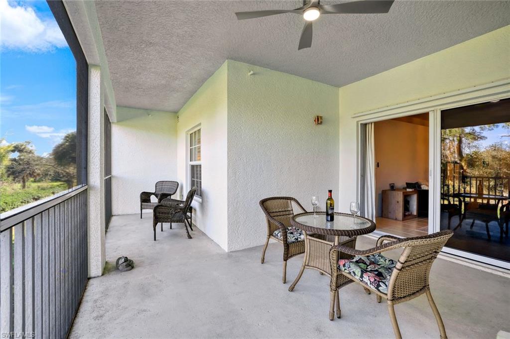 4455 Botanical Pl Circle, Unit 204 Naples, FL 34112 - Photo 11 of 26 a view of a dining room with furniture and chandelier