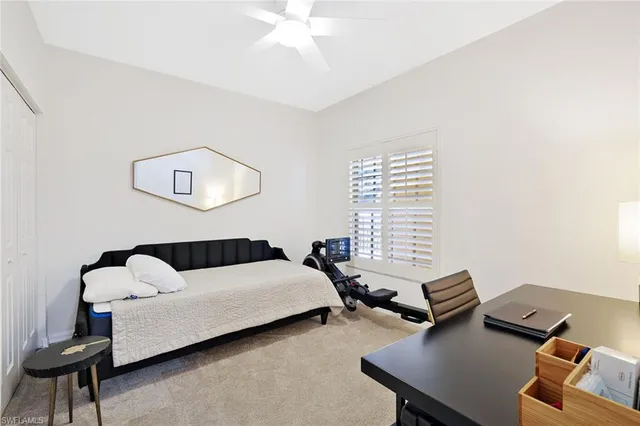 a bedroom with furniture and a window