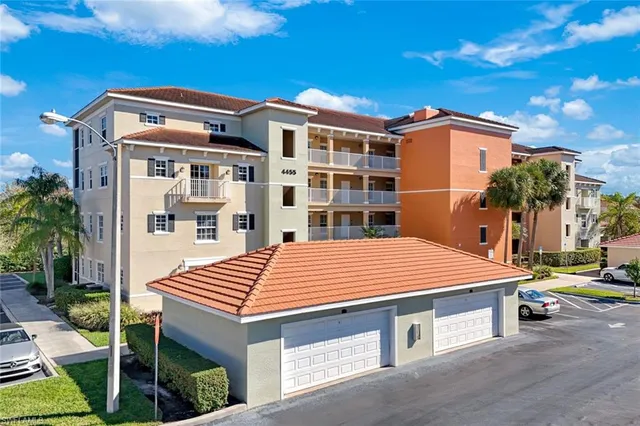 a front view of a building with a garden