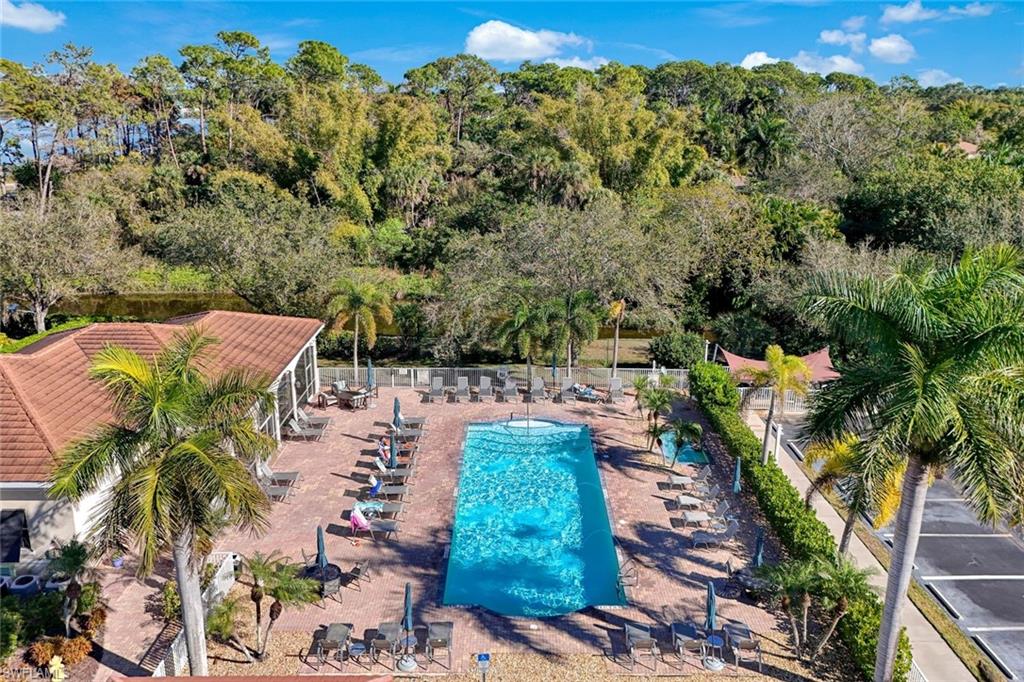 4455 Botanical Pl Circle, Unit 204 Naples, FL 34112 - Photo 20 of 26 an aerial view of a house with a yard