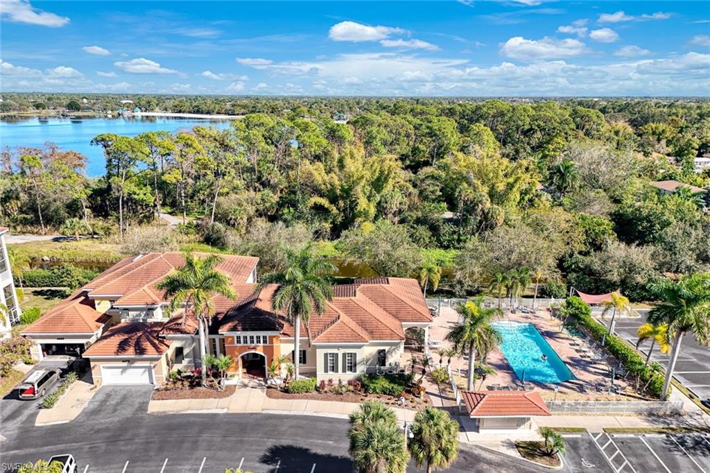 4455 Botanical Pl Circle, Unit 204 Naples, FL 34112 - Photo 24 of 26 an aerial view of residential houses with outdoor space and ocean view