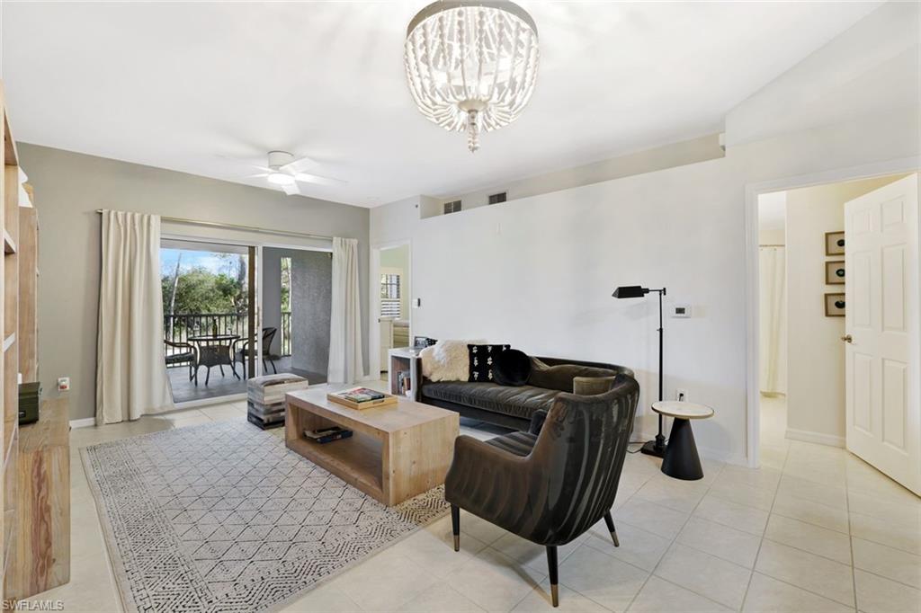 4455 Botanical Pl Circle, Unit 204 Naples, FL 34112 - Photo 8 of 26 a living room with furniture