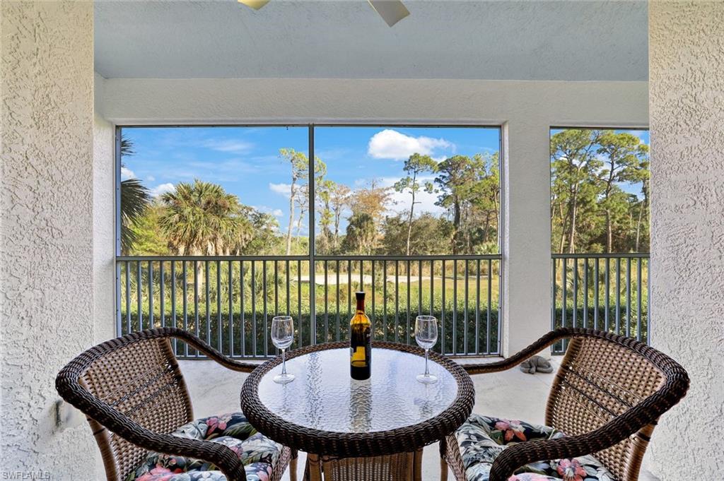 4455 Botanical Pl Circle, Unit 204 Naples, FL 34112 - Photo 10 of 26 a view of a dining room with furniture window and outside view