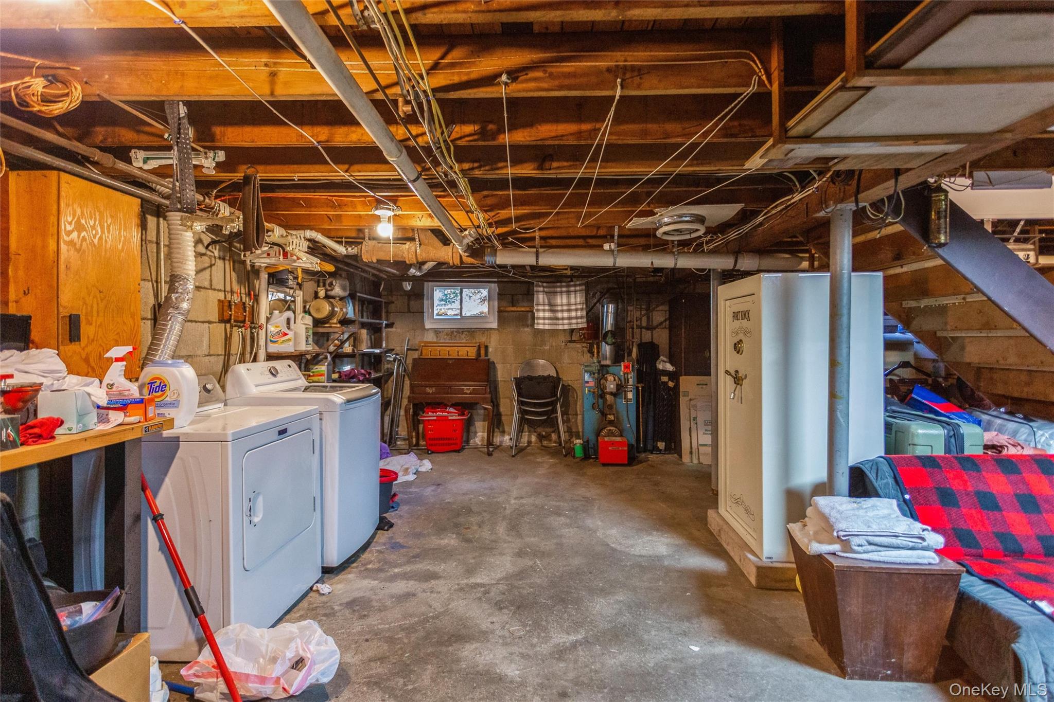 1531 Merrick Avenue Merrick, NY 11566 - Photo 22 of 26 Basement with washing machine and dryer and a heating unit
