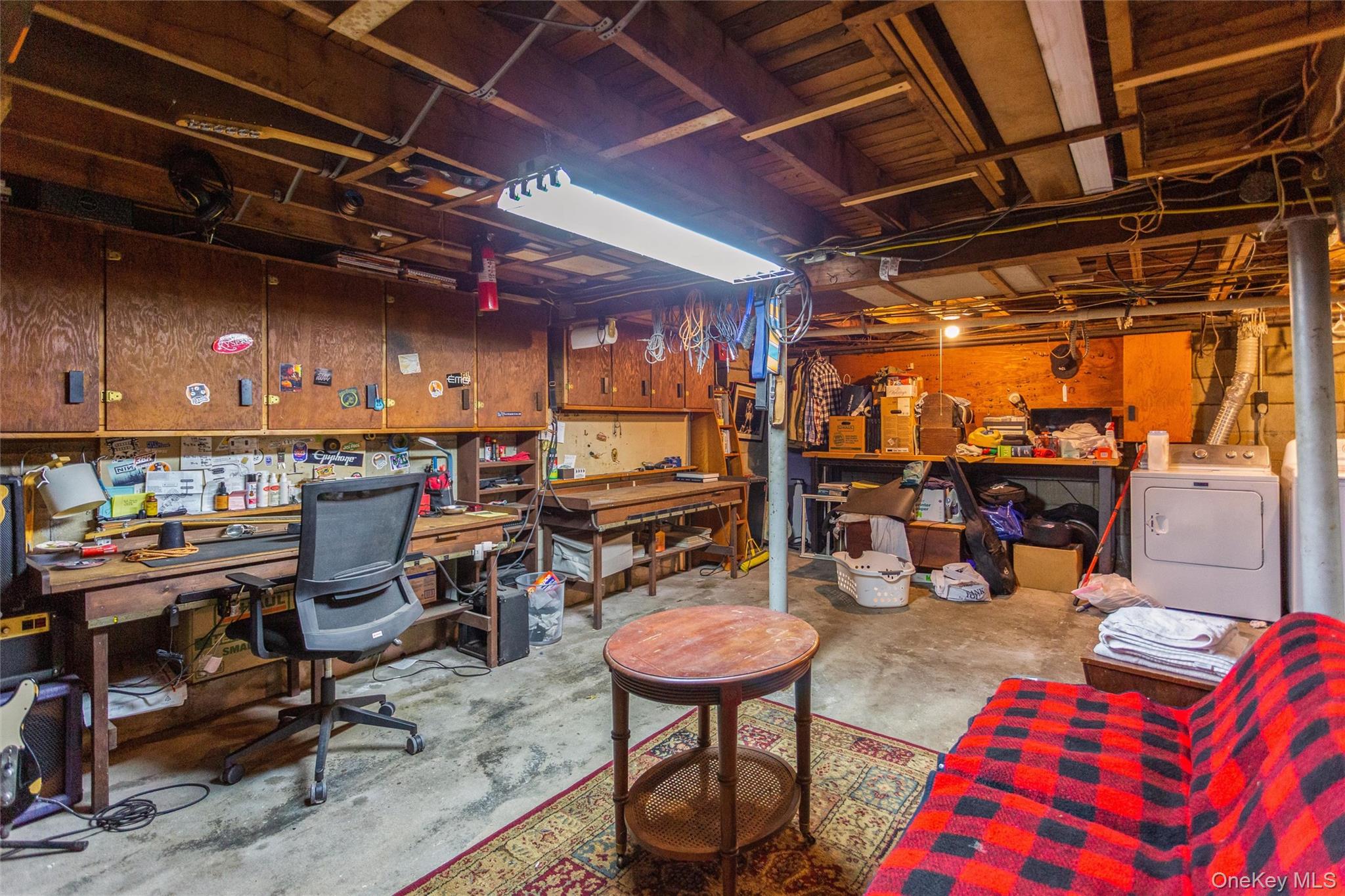 1531 Merrick Avenue Merrick, NY 11566 - Photo 23 of 26 Basement featuring a workshop area and washer / clothes dryer