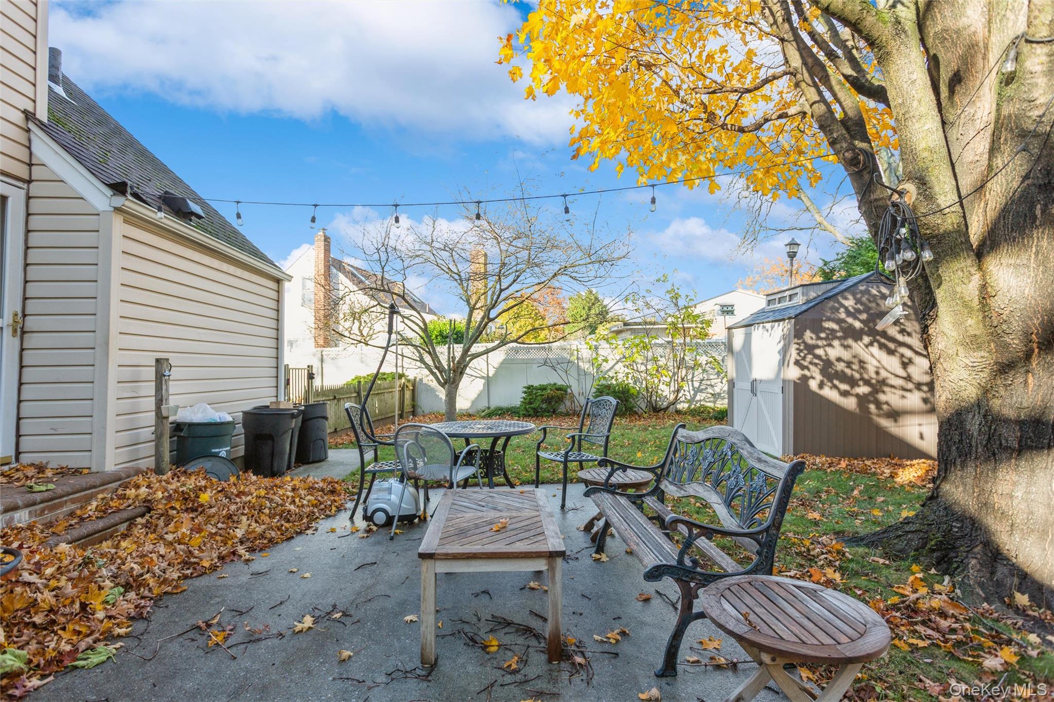 1531 Merrick Avenue Merrick, NY 11566 - Photo 25 of 26 Fenced backyard featuring a patio and a storage unit