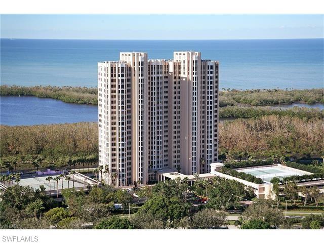 6849 Grenadier Boulevard, Unit 2104 Naples, FL 34108 - Photo 13 of 13 a view of a city with tall buildings