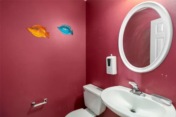 a bathroom with a sink and mirror