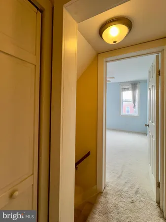 a view of a livingroom from a hallway