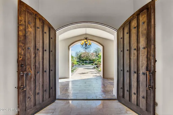 a bedroom with a large bed couch and a window