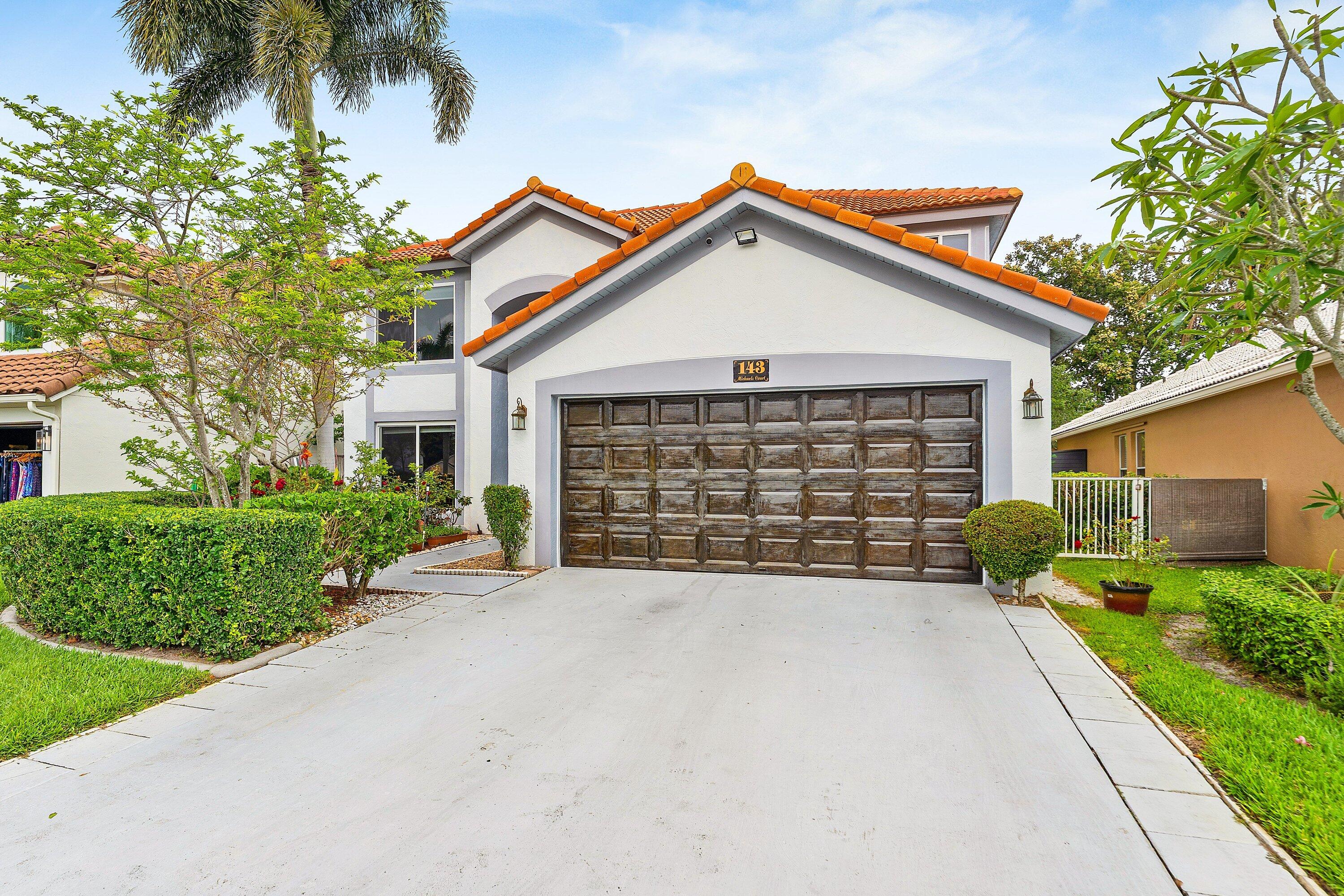 143 St Michaels Court Jupiter, FL 33458 - Photo 2 of 27 2-Car Garage