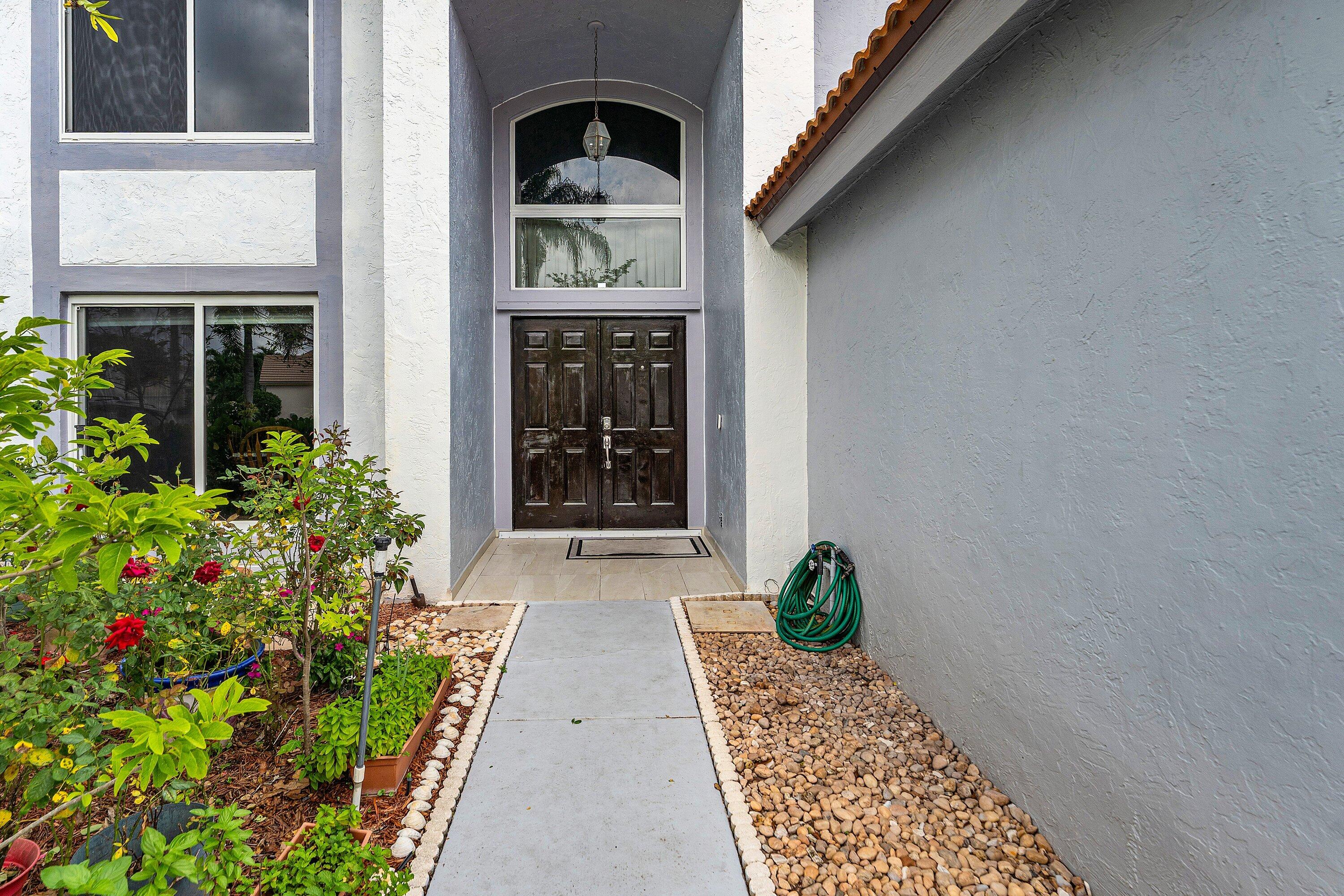 143 St Michaels Court Jupiter, FL 33458 - Photo 3 of 27 Front Entrance