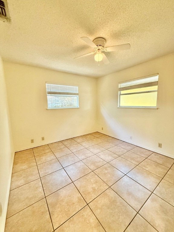 402 Myrtle Street Fulton, TX 78382 - Photo 15 of 20 a view of a room with a ceiling fan and window