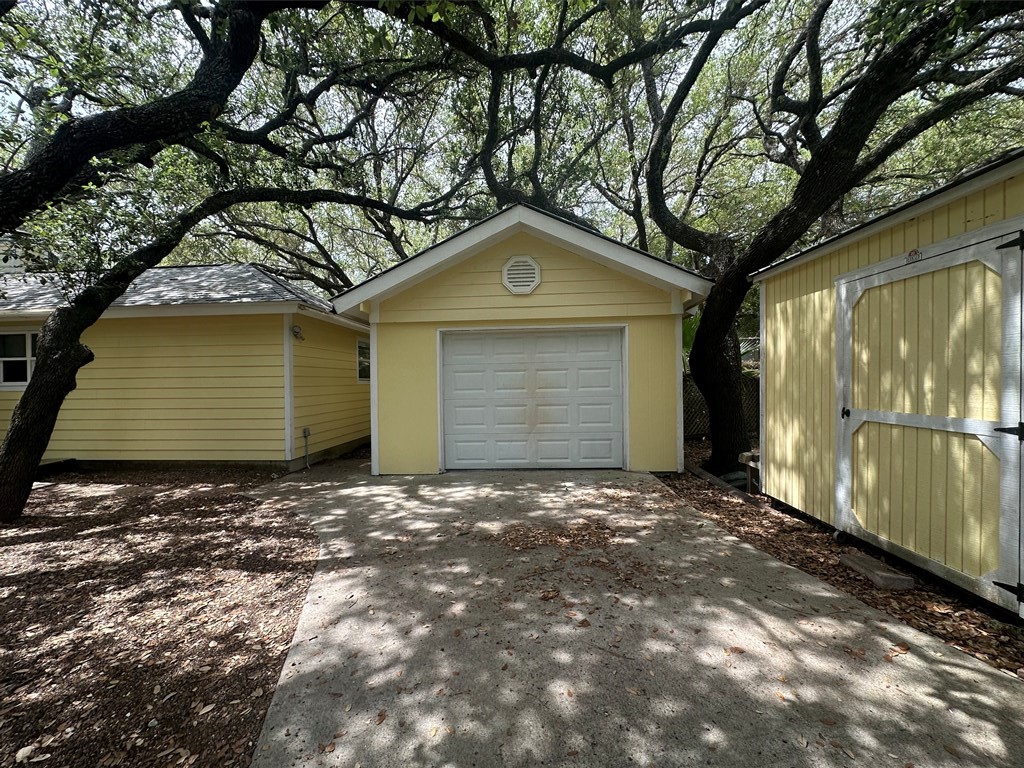 402 Myrtle Street Fulton, TX 78382 - Photo 16 of 20 a front view of a house with a yard and garage