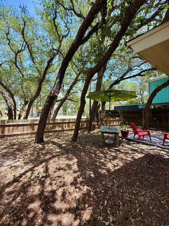 402 Myrtle Street Fulton, TX 78382 - Photo 2 of 20 a view of outdoor space with deck and tree