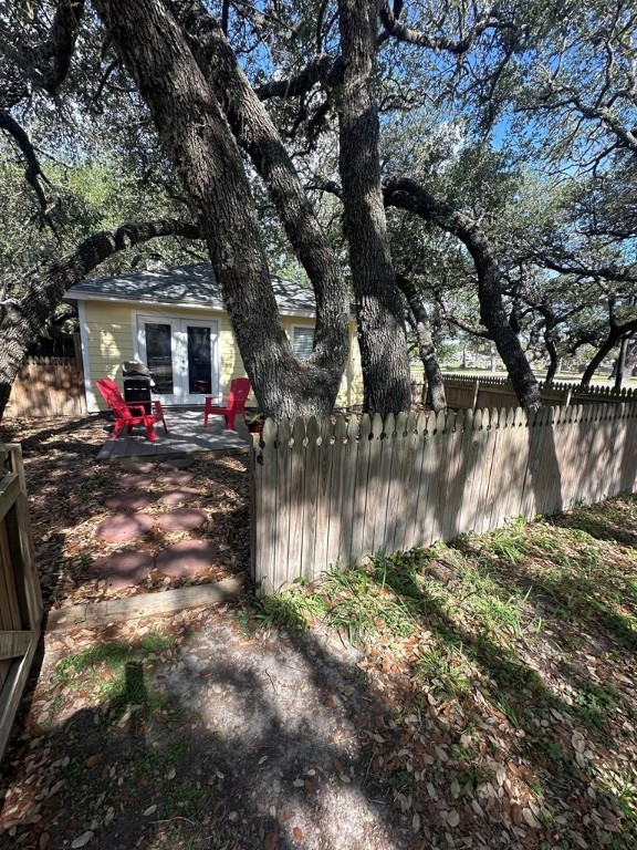 402 Myrtle Street Fulton, TX 78382 - Photo 4 of 20 a backyard of a house with yard and outdoor seating
