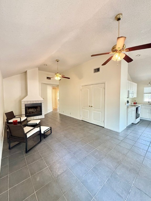 402 Myrtle Street Fulton, TX 78382 - Photo 6 of 20 a living room with furniture a dining table and a ceiling fan