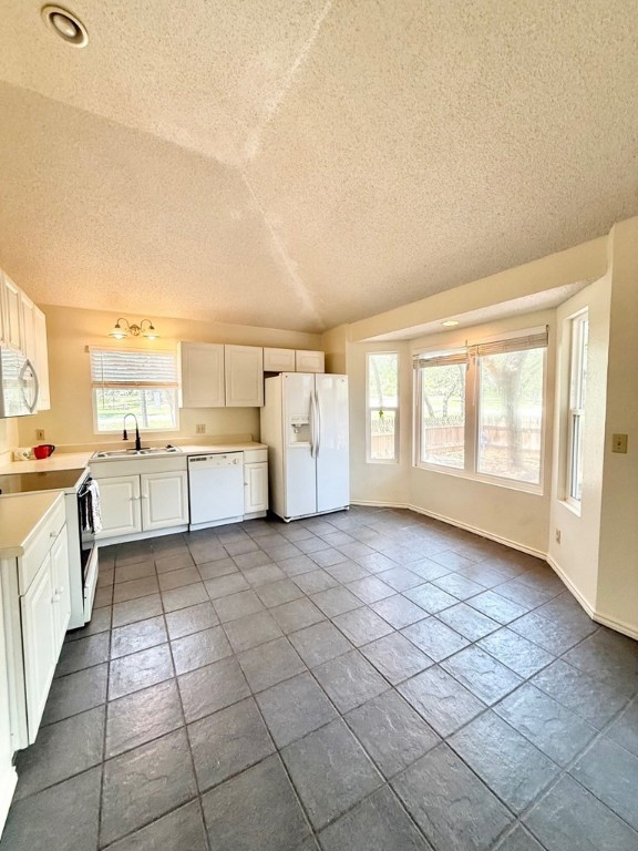 402 Myrtle Street Fulton, TX 78382 - Photo 7 of 20 a big room with windows and kitchen view