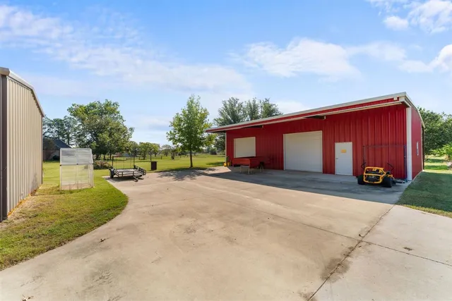 a front view of house with yard and outdoor seating