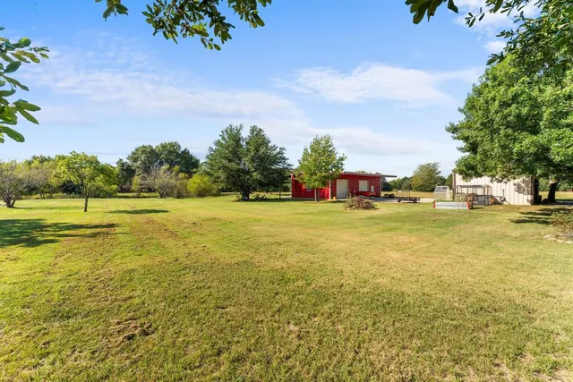 a house view with swimming pool
