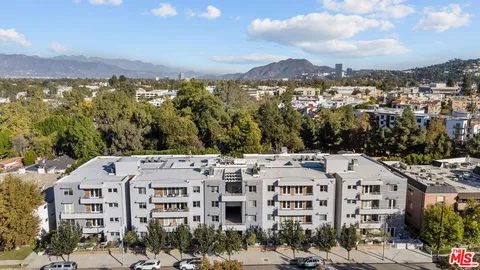 a view of a large building with a mountain