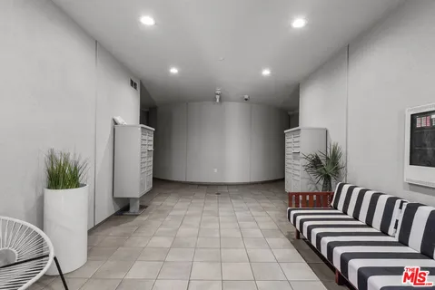 a view of kitchen with furniture and a potted plant