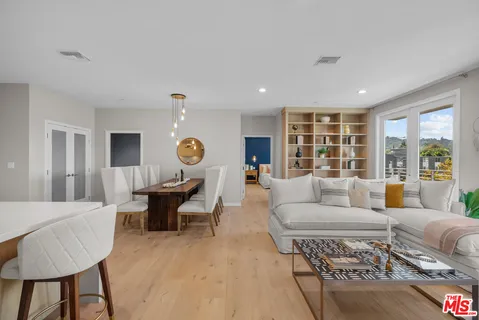 a living room with furniture and a table