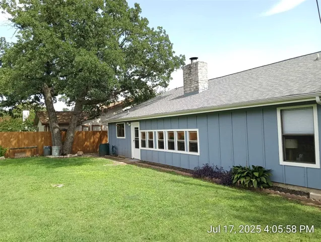 a bedroom with bunk bed and a window