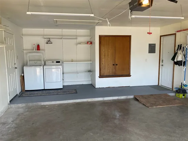 a view of storage and utility room with racks on the wall