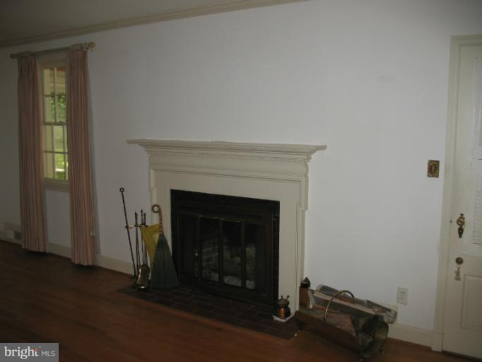 602 Coventry Road Towson, MD 21286 - Photo 2 of 28 a living room with a fireplace