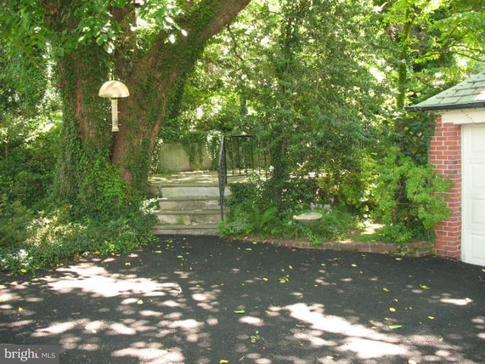 602 Coventry Road Towson, MD 21286 - Photo 14 of 28 a view of a street with a tree