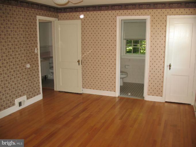 602 Coventry Road Towson, MD 21286 - Photo 22 of 28 wooden floor in a empty room