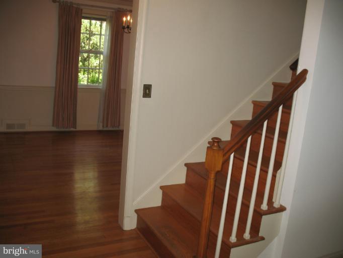 602 Coventry Road Towson, MD 21286 - Photo 24 of 28 a view of staircase with wooden floor and stairs