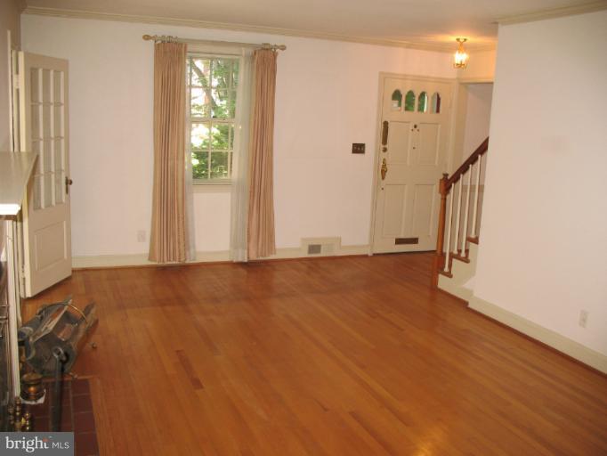 602 Coventry Road Towson, MD 21286 - Photo 27 of 28 an empty room with wooden floor and windows
