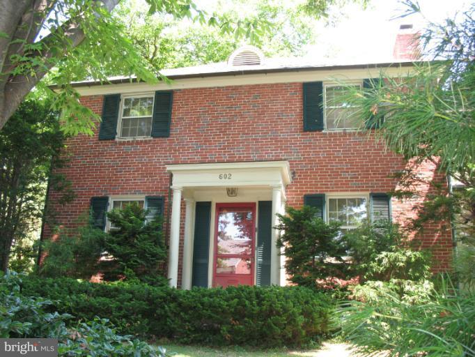 602 Coventry Road Towson, MD 21286 - Photo 28 of 28 front view of a house with potted plants and a bench