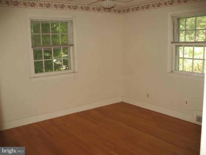 602 Coventry Road Towson, MD 21286 - Photo 4 of 28 an empty room with a window