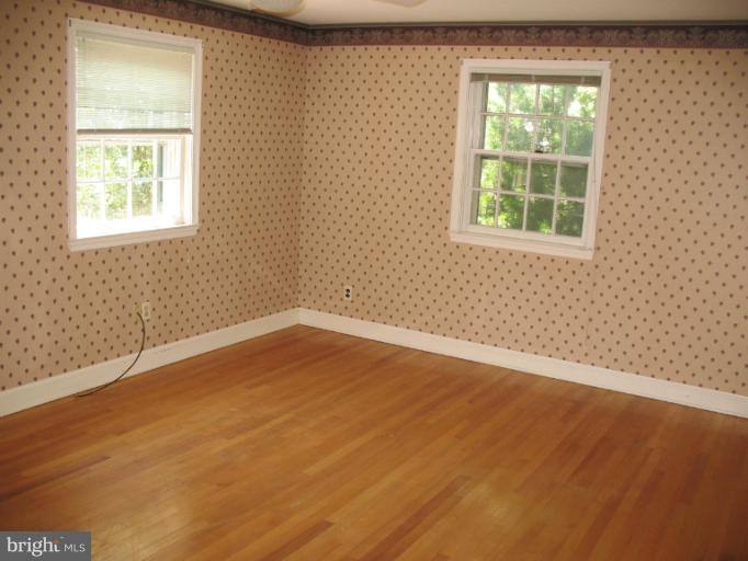 602 Coventry Road Towson, MD 21286 - Photo 7 of 28 an empty room with a window