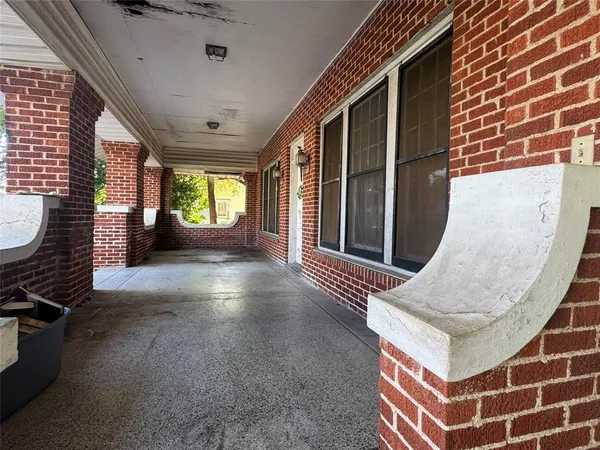 a view of an entryway with a floor to ceiling window