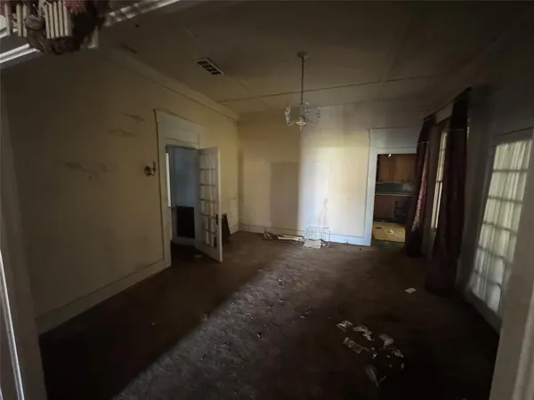 a view of a hallway with a kitchen