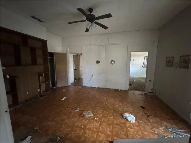 a view of a livingroom with a kitchen