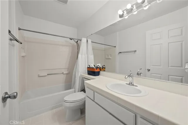 a bed room with a bed and a window